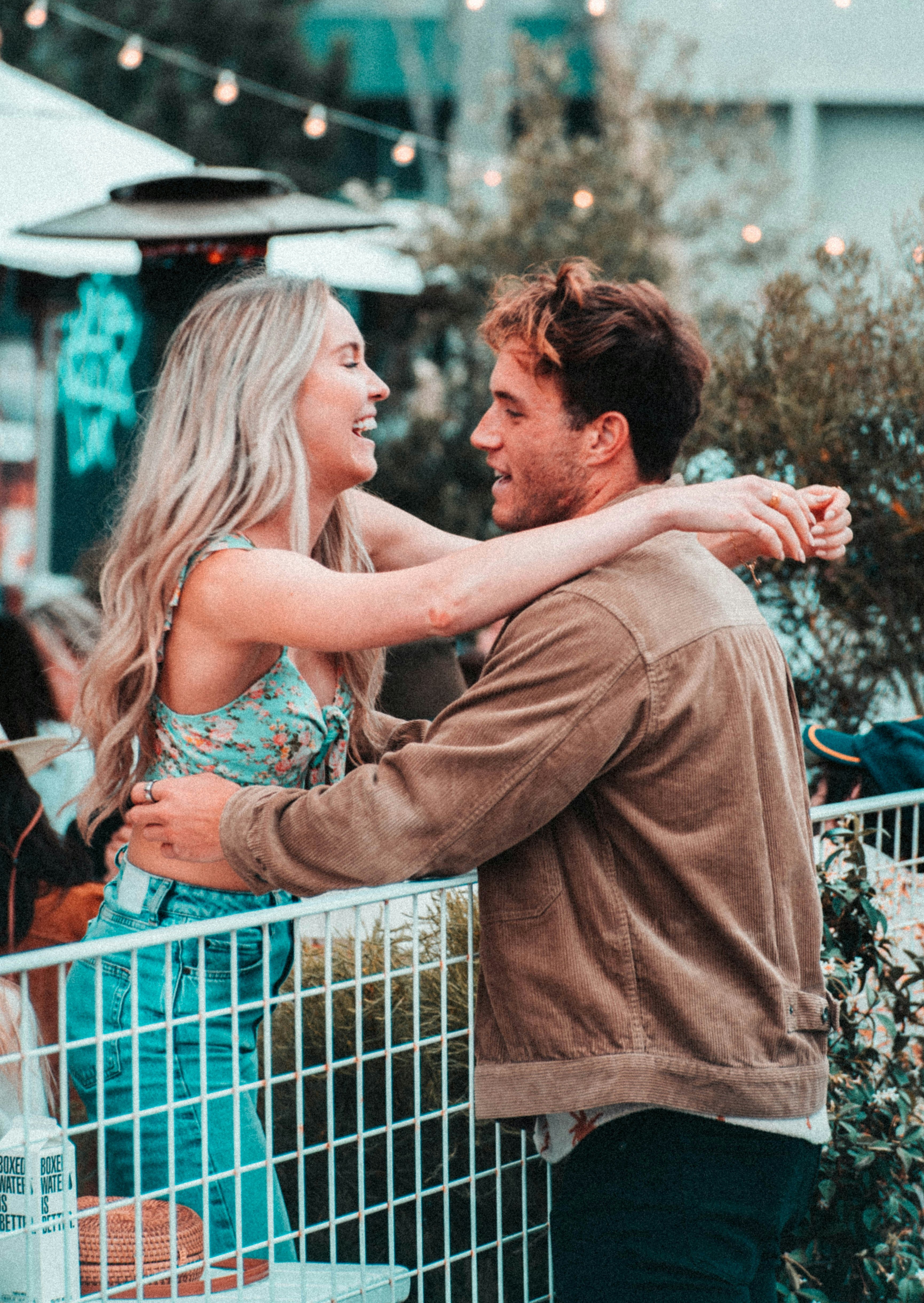 A couple meeting at an outdoor patio